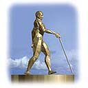 golden statue of man with mobility cane